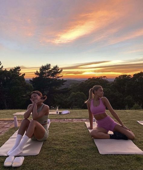 Women sitting on yoga mats